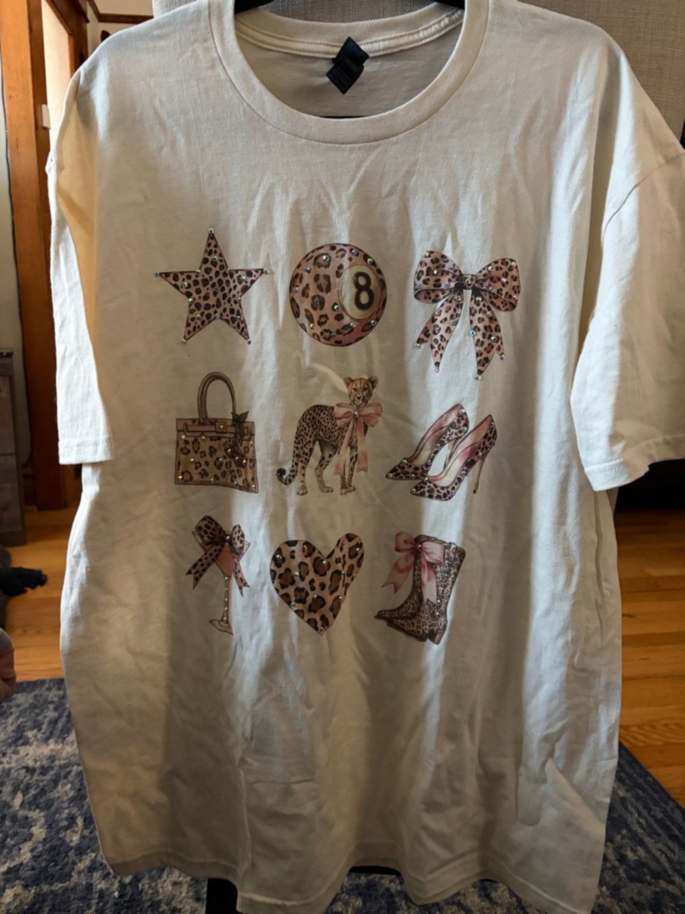 Never worn. Adorable woman’s Graphic Tee with Leopard Print Accents and sparkle!
